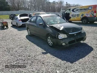 2004 Kia Spectra LX with VIN KNAFE121X45021922, listed as a Copart auction lot 49989845 with 184,189 mi miles and Salvage Title. Bid and sale history available at carsss.com. Image 10.