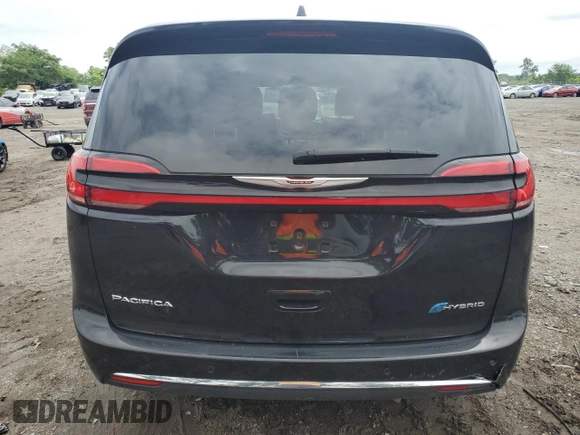 2024 Chrysler Pacifica Hybrid Select with VIN 2C4RC1S7XRR130577, listed as a Copart auction lot 58790055 with 30,530 mi miles and Clean title. Bid and sale history available at DreamBid. Image 6.