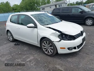 2012 Volkswagen Golf TDI w/Sunroof & Nav with VIN WVWBM7AJ6CW336038, listed as a IAAI auction lot 42672300 with 157,411 mi miles and . Bid and sale history available at DreamBid. Image 1.