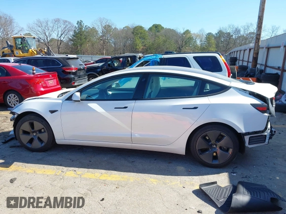 2022 Tesla Model 3 with VIN 5YJ3E1EA7NF103513, listed as a IAAI auction lot 41643592 with 35,631 mi miles and . Bid and sale history available at DreamBid. Image 14.