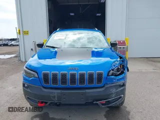 2022 Jeep Cherokee Trailhawk z VIN 1C4PJMBX4ND513488, wystawiony jako IAAI lot #42137114 z przebiegiem 12 306 mil mil oraz . Historia ofert i sprzedaży dostępna na DreamBid. Obrazek 12.