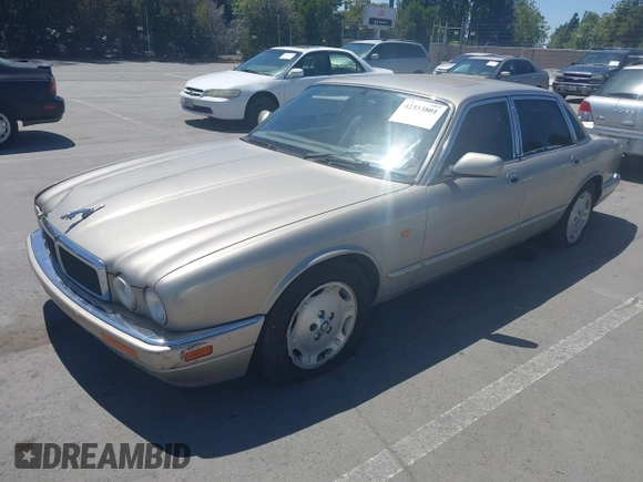 1997 Jaguar XJ with VIN SAJHX1243VC811674, listed as a IAAI auction lot 42333801 with 213,248 mi miles and . Bid and sale history available at DreamBid. Image 2.