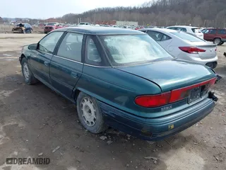 1995 Mercury Sable GS with VIN 1MELM50U8SA632936, listed as a IAAI auction lot 41695182 with 124,194 mi miles. Bid and sale history available at carsss.com. Image 3.