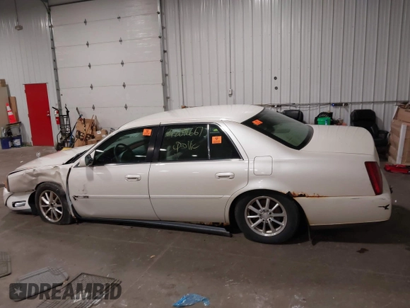 2003 Cadillac DeVille with VIN 1G6KD54Y63U178022, listed as a IAAI auction lot 42076667 with 141,863 mi miles. Bid and sale history available at carsss.com. Image 14.