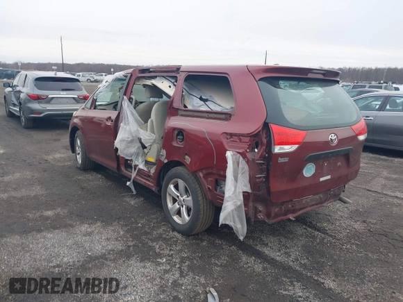 2014 Toyota Sienna L with VIN 5TDZK3DC8ES477402, listed as a IAAI auction lot 41494073 with 102,063 mi miles. Bid and sale history available at carsss.com. Image 3.