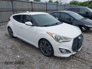 2016 Hyundai Veloster Turbo z VIN KMHTC6AEXGU268764, wystawiony jako IAAI lot #42373304 z przebiegiem 146 000 mil mil oraz . Historia ofert i sprzedaży dostępna na DreamBid. Obrazek 1.