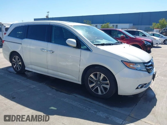2015 Honda Odyssey Touring Elite with VIN 5FNRL5H91FB038099, listed as a IAAI auction lot 41829649 with 167,017 mi miles and . Bid and sale history available at DreamBid. Image 1.