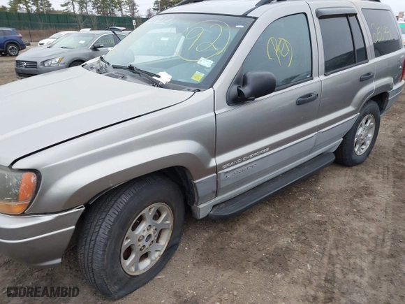 1999 Jeep Grand Cherokee Laredo with VIN 1J4GW58S9XC673310, listed as a IAAI auction lot 41927682 with 999,999 mi miles. Bid and sale history available at carsss.com. Image 6.