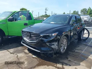 2021 Mazda CX-9 Carbon Edition with VIN JM3TCBDY3M0524241, listed as a IAAI auction lot 42538127 with 50,533 mi miles and . Bid and sale history available at DreamBid. Image 2.