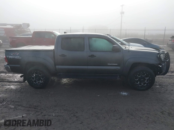 2015 Toyota Tacoma with VIN 3TMLU4EN7FM201302, listed as a IAAI auction lot 41666606 with 200,504 mi miles and . Bid and sale history available at DreamBid. Image 14.