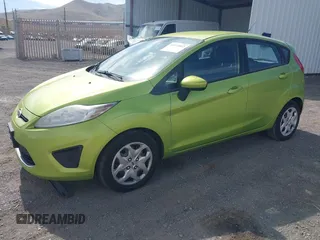 2011 Ford Fiesta SE with VIN 3FADP4EJ8BM157173, listed as a IAAI auction lot 41972892 with 407,227 mi miles. Bid and sale history available at carsss.com. Image 2.