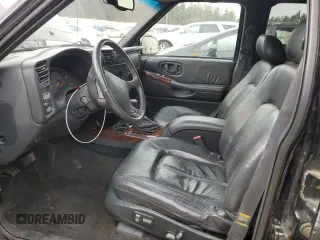 1998 Oldsmobile Bravada z VIN 1GHDT13W9W2730673, wystawiony jako Copart lot #80996524 z przebiegiem 126 418 mil mil oraz Nie do naprawy. Historia ofert i sprzedaży dostępna na DreamBid. Obrazek 7.