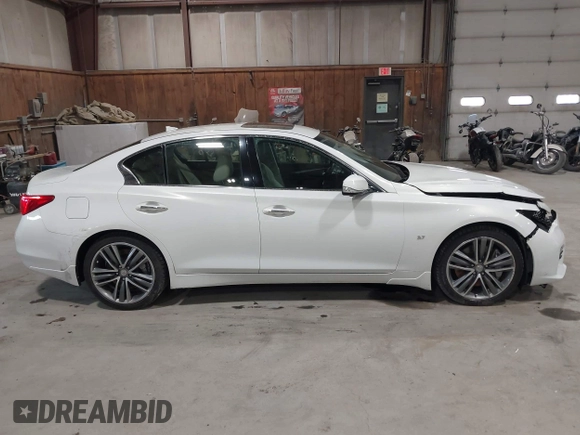 2015 Infiniti Q50 z VIN JN1BV7ARXFM409367, wystawiony jako IAAI lot #41912056 z przebiegiem 126 382 mil mil oraz . Historia ofert i sprzedaży dostępna na DreamBid. Obrazek 13.