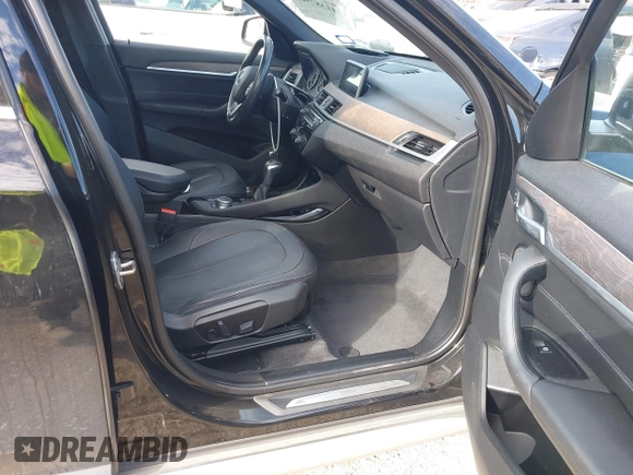 2016 BMW X1 xDrive28i with VIN WBXHT3Z3XG4A48557, listed as a IAAI auction lot 41387960 with 84,821 mi miles. Bid and sale history available at carsss.com. Image 5.