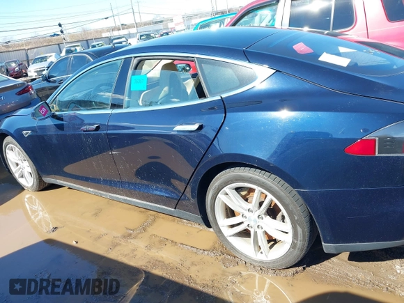 2013 Tesla Model S with VIN 5YJSA1CG2DFP14689, listed as a IAAI auction lot 41648508 with 98,578 mi miles and . Bid and sale history available at carsss.com. Image 13.