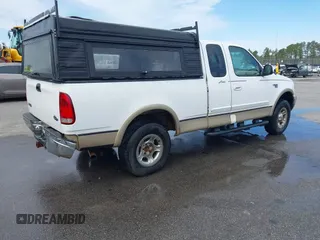 1999 Ford F-150 XL with VIN 1FTRX18LXXNA16159, listed as a IAAI auction lot 41746440 with 999,999 mi miles. Bid and sale history available at carsss.com. Image 4.