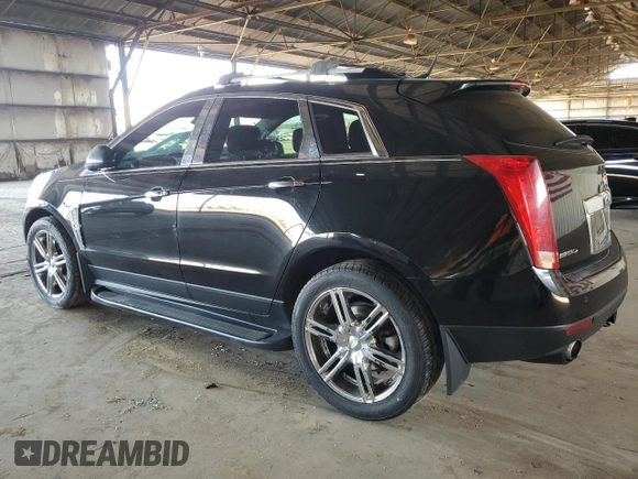 2012 Cadillac SRX Premium Collection z VIN 3GYFNFE30CS599863, wystawiony jako Copart lot #61249995 z przebiegiem 144 740 mil mil oraz Czysty tytuł • Clean title. Historia ofert i sprzedaży dostępna na DreamBid. Obrazek 2.