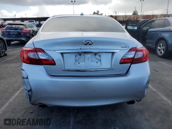 2012 Infiniti M Hybrid with VIN JN1EY1AP3CM910631, listed as a Copart auction lot 49162705 with 128,771 mi miles and Salvage title. Bid and sale history available at DreamBid. Image 6.