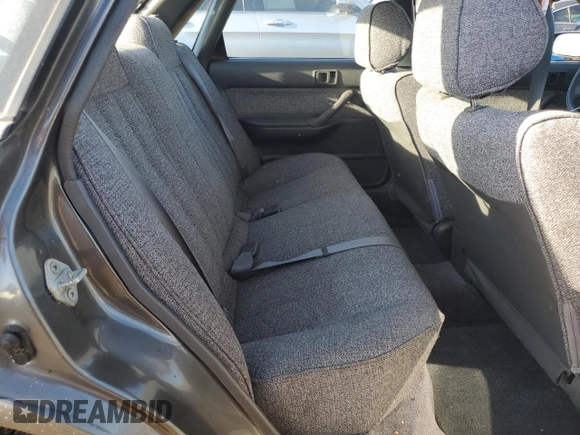 1989 Toyota Camry z VIN JT2SV21E8K0314703, wystawiony jako Copart lot #76053194 z przebiegiem 124 873 mil mil oraz Nie do naprawy • Non repairable. Historia ofert i sprzedaży dostępna na DreamBid. Obrazek 10.