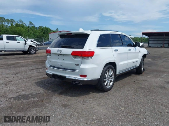2014 Jeep Grand Cherokee Summit with VIN 1C4RJFJT6EC281114, listed as a IAAI auction lot 42497582 with 128,181 mi miles and . Bid and sale history available at DreamBid. Image 4.