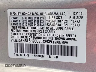 2012 Honda Odyssey Touring with VIN 5FNRL5H96CB043939, listed as a IAAI auction lot 41983643 with 202,535 mi miles. Bid and sale history available at carsss.com. Image 9.