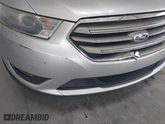 2014 Ford Taurus SEL z VIN 1FAHP2E82EG139690, wystawiony jako IAAI lot #42312483 z przebiegiem 170 029 mil mil oraz . Historia ofert i sprzedaży dostępna na DreamBid. Obrazek 6.