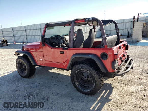1999 Jeep Wrangler SE with VIN 1J4FY29P8XP483909, listed as a Copart auction lot 48679555 with 168,708 mi miles and Salvage title. Bid and sale history available at DreamBid. Image 2.