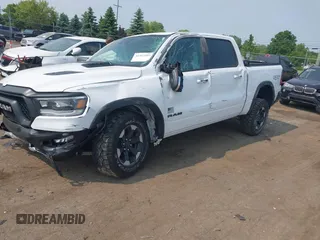 2022 Ram 1500 Rebel with VIN 1C6SRFLT5NN318494, listed as a IAAI auction lot 42413194 with 59,458 mi miles and . Bid and sale history available at DreamBid. Image 2.