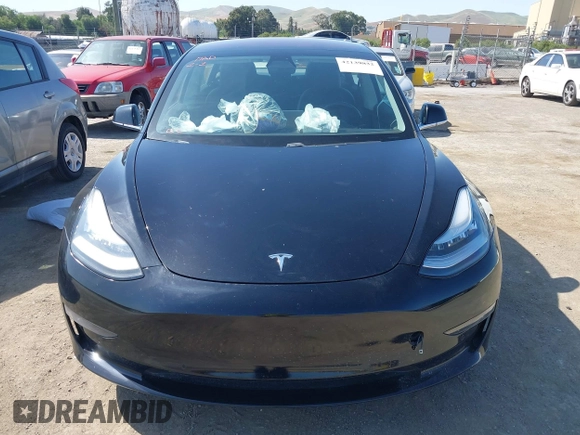 2018 Tesla Model 3 Long Range Battery with VIN 5YJ3E1EA7JF057031, listed as a IAAI auction lot 42139832 with 92,618 mi miles and . Bid and sale history available at DreamBid. Image 11.