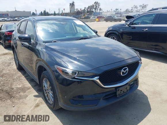 2017 Mazda CX-5 Touring with VIN JM3KFACL0H0124632, listed as a IAAI auction lot 42134971 with 107,029 mi miles and . Bid and sale history available at carsss.com. Image 1.