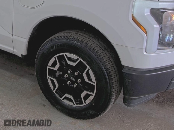 2022 Ford F-150 Lightning Pro with VIN 1FTVW1EL5NWG11725, listed as a IAAI auction lot 42832825 with 5,044 mi miles and . Bid and sale history available at DreamBid. Image 2.