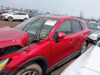 2014 Mazda CX-5 Touring with VIN JM3KE2CY4E0411780, listed as a IAAI auction lot 41903570 with 103,658 mi miles and . Bid and sale history available at DreamBid. Image 14.