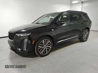 2023 Cadillac XT6 AWD Sport z VIN 1GYKPGRS3PZ133580, wystawiony jako Copart lot #44825095 z przebiegiem 12 168 mil mil oraz Czysty tytuł • Clean title. Historia ofert i sprzedaży dostępna na DreamBid. Obrazek 1.