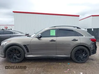 2014 Infiniti QX70 z VIN JN8CS1MU3EM451745, wystawiony jako IAAI lot #42203922 z przebiegiem 144 990 mil mil oraz . Historia ofert i sprzedaży dostępna na DreamBid. Obrazek 14.