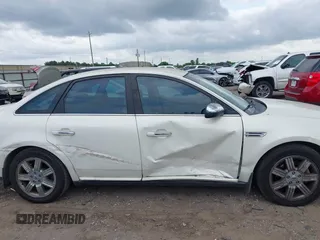 2009 Ford Taurus Limited z VIN 1FAHP25W79G104342, wystawiony jako IAAI lot #42140990 z przebiegiem 130 214 mil mil oraz . Historia ofert i sprzedaży dostępna na DreamBid. Obrazek 13.