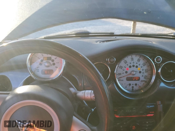 2007 MINI Convertible with VIN WMWRF33597TG16707, listed as a Copart auction lot 79104014 with 113,380 mi miles and Salvage Title. Bid and sale history available at DreamBid. Image 9.