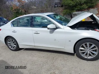 2015 Infiniti Q50 Premium z VIN JN1BV7ARXFM399617, wystawiony jako IAAI lot #41884672 z przebiegiem 116 320 mil mil oraz . Historia ofert i sprzedaży dostępna na DreamBid. Obrazek 13.