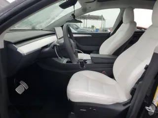 2024 Tesla Model Y Performance with VIN 7SAYGDEF1RF028278, listed as a Copart auction lot 48900935 with 41,606 mi miles and Salvage Title. Bid and sale history available at DreamBid. Image 7.