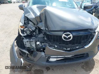 2014 Mazda CX-5 Sport with VIN JM3KE2BE0E0411377, listed as a IAAI auction lot 42143229 with 137,384 mi miles and . Bid and sale history available at carsss.com. Image 6.