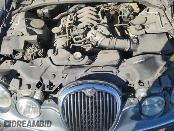 2003 Jaguar S-Type z VIN SAJEA01U03HM57757, wystawiony jako Copart lot #73440434 z przebiegiem 188 389 mil mil oraz Szkoda całkowita • Salvage title. Historia ofert i sprzedaży dostępna na DreamBid. Obrazek 11.