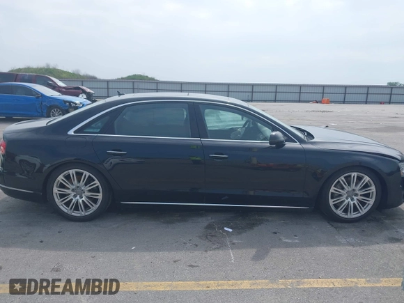 2015 Audi A8 4.0T with VIN WAU32AFD6FN002710, listed as a IAAI auction lot 42447149 with 109,791 mi miles and . Bid and sale history available at DreamBid. Image 12.