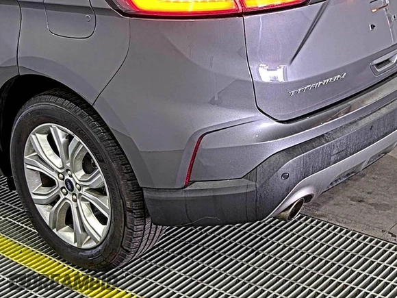 2021 Ford Edge Titanium z VIN 2FMPK3K92MBA53689, wystawiony jako IAAI lot #42501151 z przebiegiem 93 941 mil mil oraz . Historia ofert i sprzedaży dostępna na DreamBid. Obrazek 6.