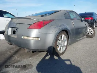 2004 Nissan 350Z Touring with VIN JN1AZ34E84T060682, listed as a IAAI auction lot 41616199 with 209,814 mi miles. Bid and sale history available at carsss.com. Image 4.