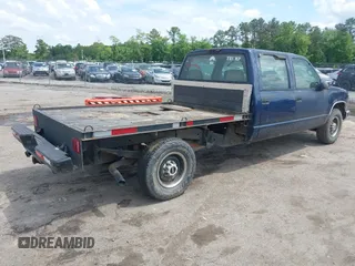 2000 GMC Sierra 3500 z VIN 1GTGC33R1YF502154, wystawiony jako IAAI lot #42183662 z przebiegiem 157 504 mil mil oraz . Historia ofert i sprzedaży dostępna na DreamBid. Obrazek 4.