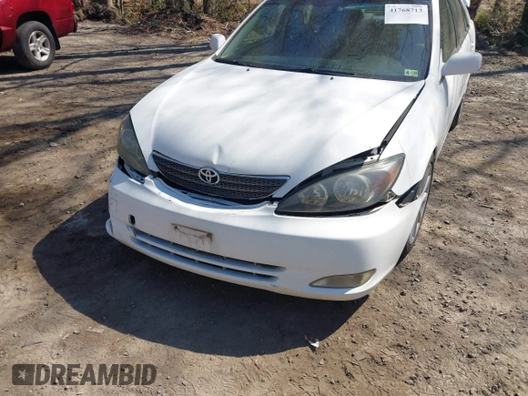 2003 Toyota Camry LE z VIN JTDBF30K930147772, wystawiony jako IAAI lot #41768713 z przebiegiem 231 537 mil mil oraz . Historia ofert i sprzedaży dostępna na DreamBid. Obrazek 6.