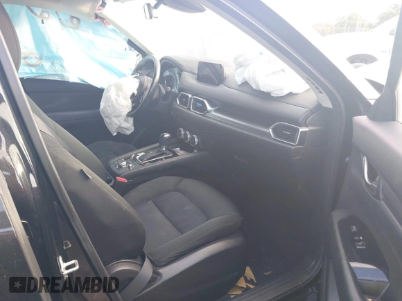 2019 Mazda CX-5 Sport with VIN JM3KFABMXK0693540, listed as a IAAI auction lot 41523569 with 57,895 mi miles and . Bid and sale history available at DreamBid. Image 5.