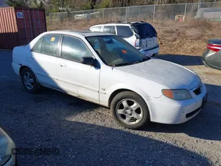 2001 Mazda Protege LX with VIN JM1BJ225710406286, listed as a IAAI auction lot 41887127 with Not Provided miles and . Bid and sale history available at DreamBid. Image 1.