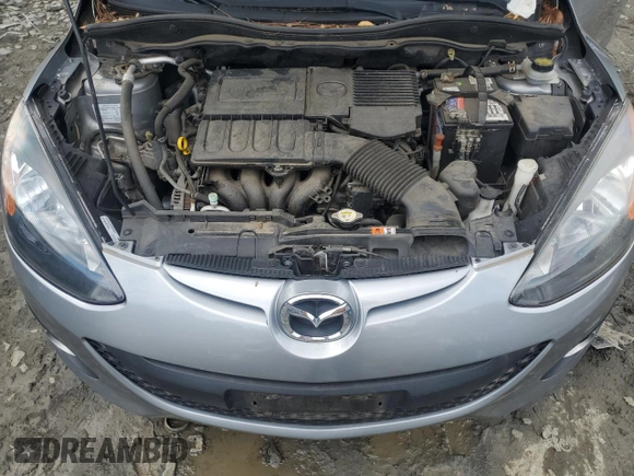 2013 Mazda 2 Touring z VIN JM1DE1LZ7D0153662, wystawiony jako Copart lot #58562435 z przebiegiem 109 329 mil mil oraz Szkoda całkowita • Salvage title. Historia ofert i sprzedaży dostępna na DreamBid. Obrazek 11.