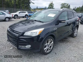 2014 Ford Escape Titanium with VIN 1FMCU9J95EUD60587, listed as a IAAI auction lot 42129854 with 155,559 mi miles and . Bid and sale history available at DreamBid. Image 2.
