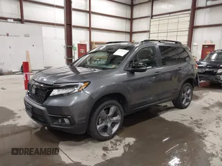 2019 Honda Passport Touring with VIN 5FNYF8H98KB007933, listed as a IAAI auction lot 41953263 with 87,614 mi miles and . Bid and sale history available at DreamBid. Image 2.